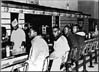 Photo of four black students sitting-in at lunch counter
